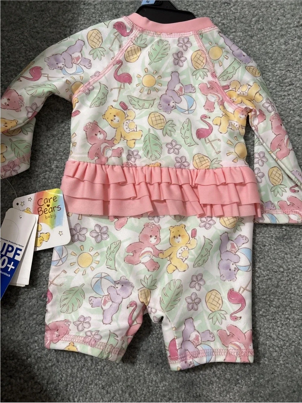 Care Bears Pastel Multicolor Pink-Trim UPF 50+ Baby Swim Romper One Piece NWT